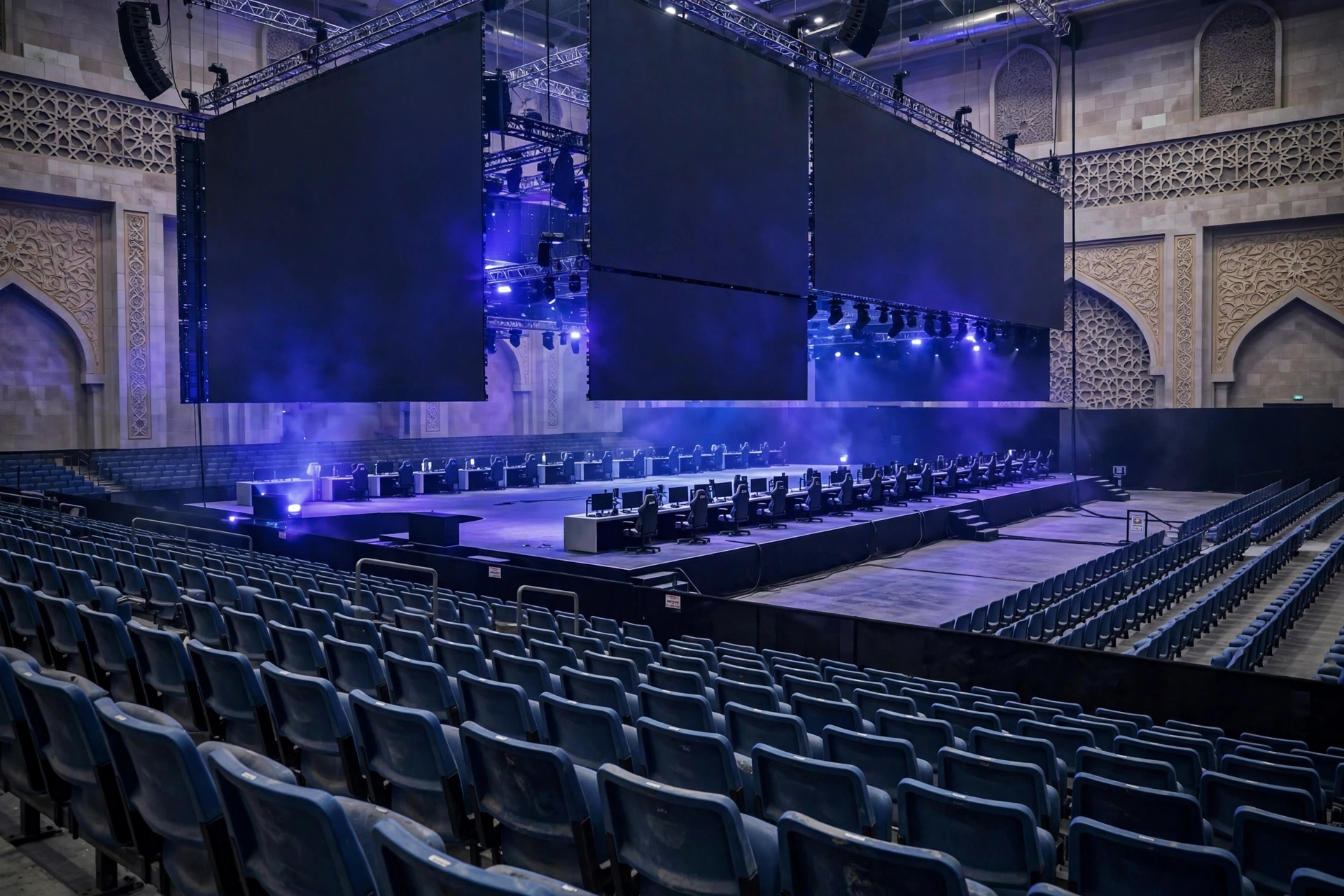 An empty esports arena in Jeddah, Saudi Arabia, with dark LED screens and dramatic lighting ahead of the postponed FIFAe Finals 2026.