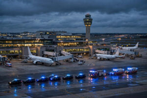 Ben Gurion Airport tarmac at dusk with police and emergency vehicles responding to the Flydubai FZ1073 security alert