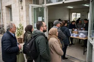 Voters queue outside a polling station in Israel on election day as officials count ballots